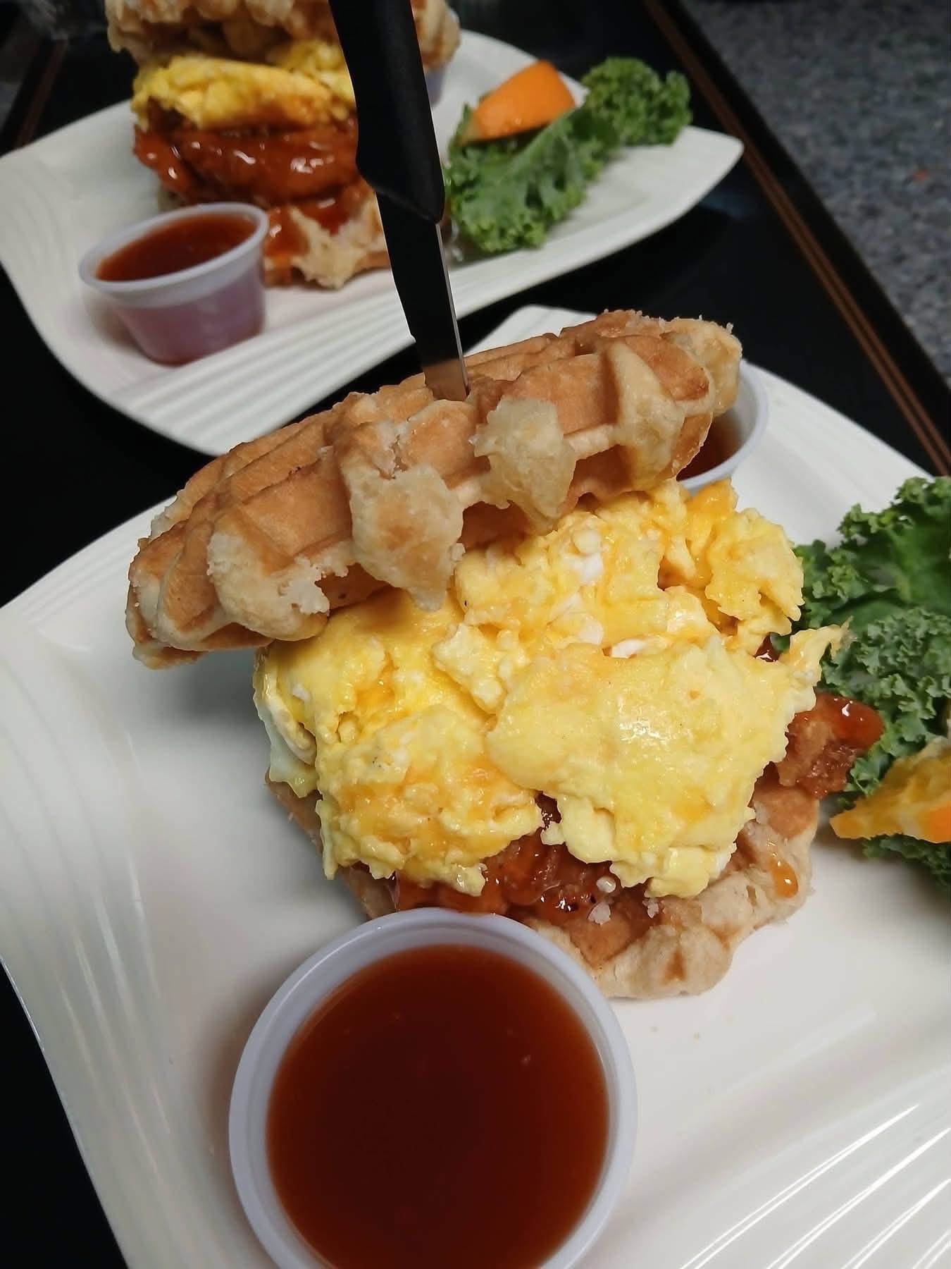 Phamilyden chicken and waffle stack with eggs